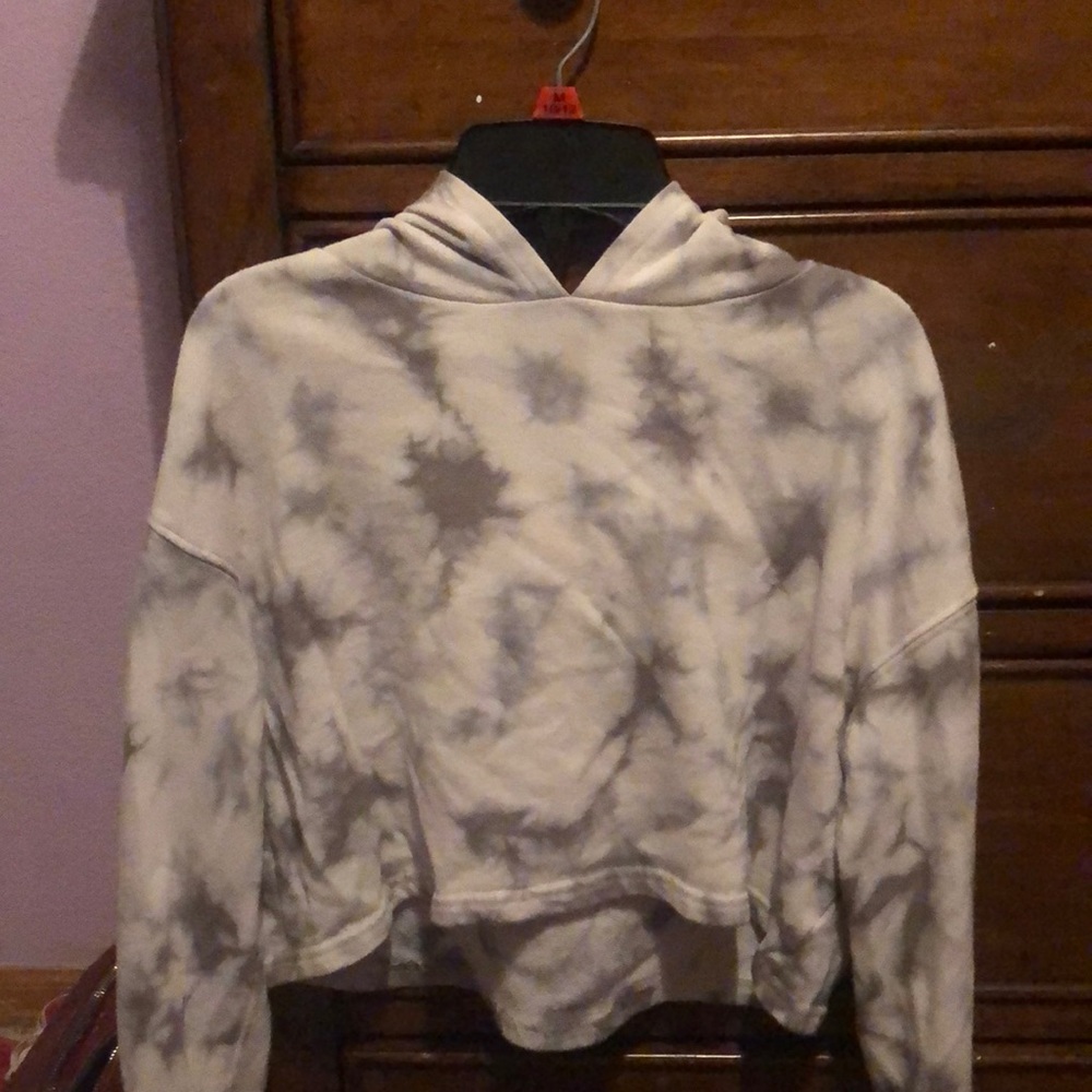 This is a Gray and white tie-dye cropped hoodie